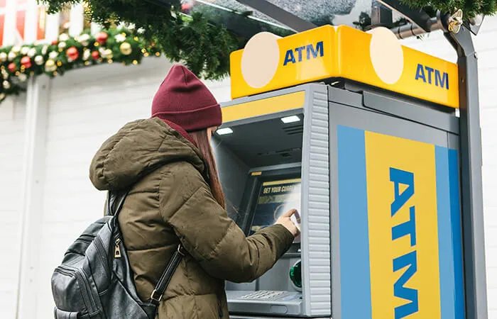 woman using ATM in Prague