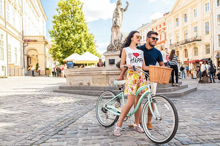 couple walking with bicycle