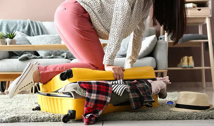 woman packing luggage