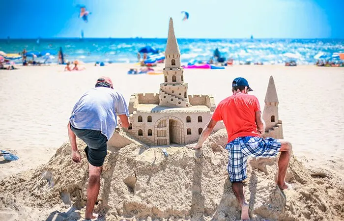 Sandcastle Lessons On The Beach